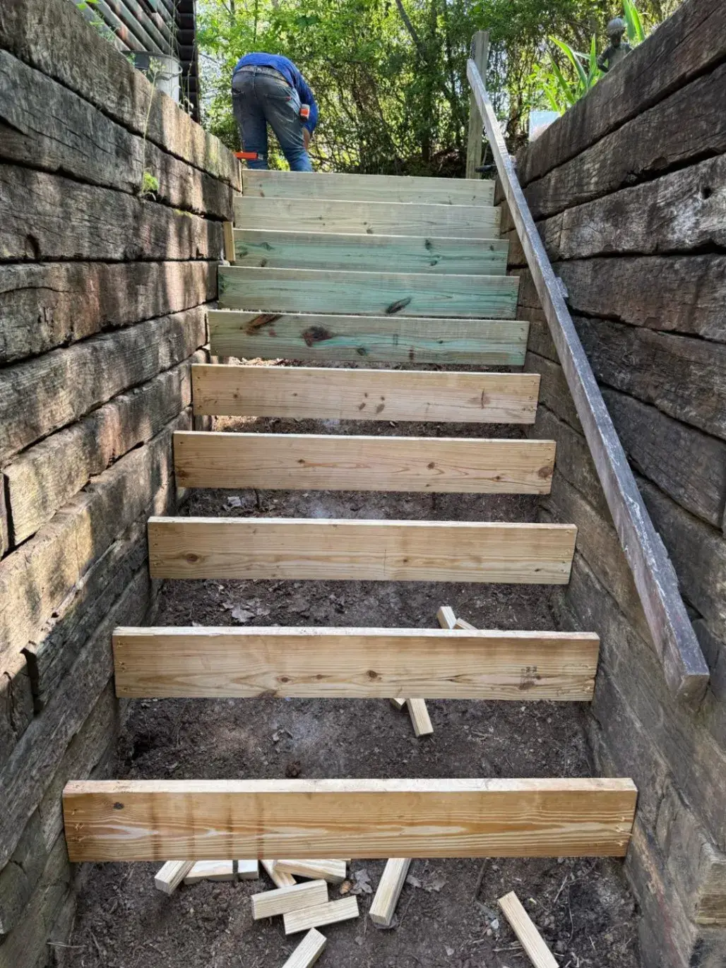 Wood forms set on the hillside for concrete steps
