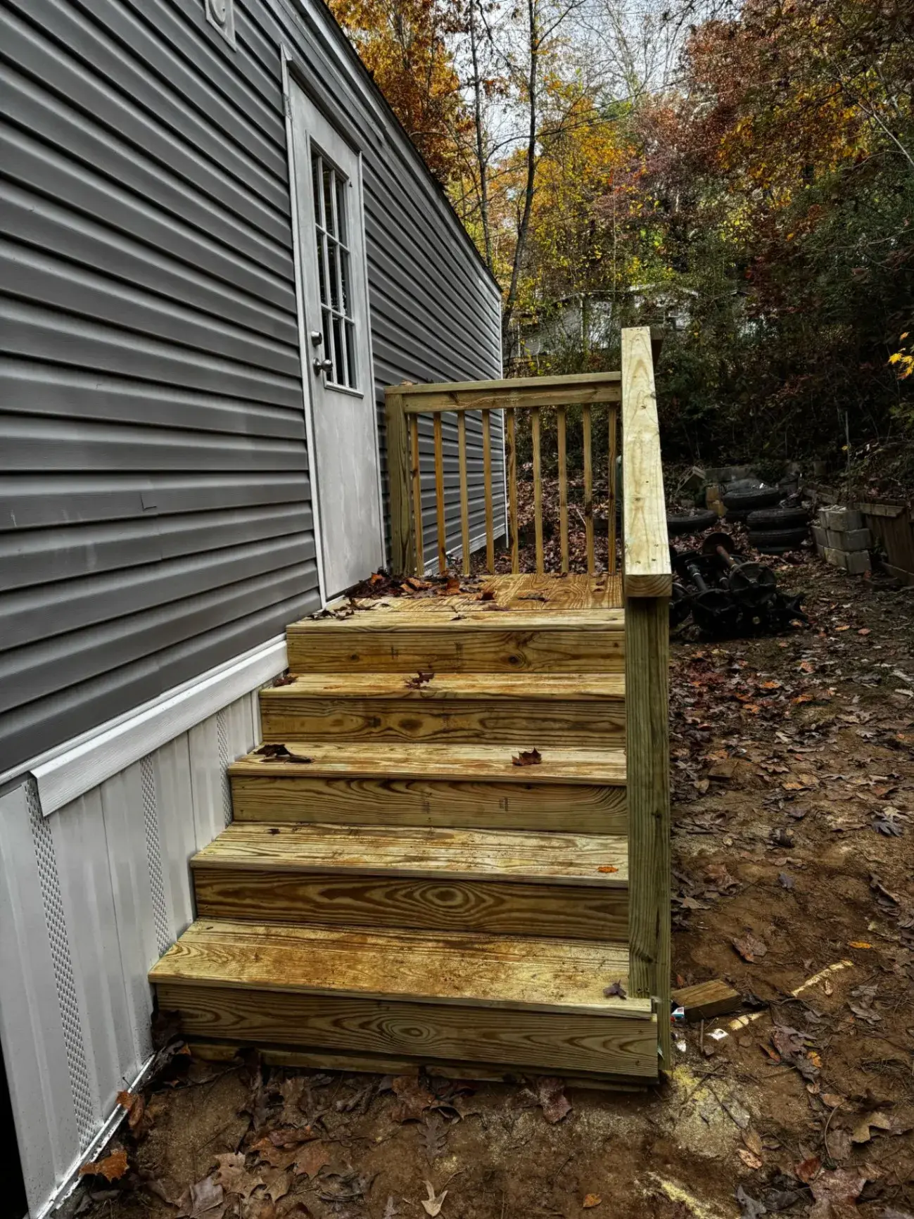 Entry stairs and railing at the back door of a home