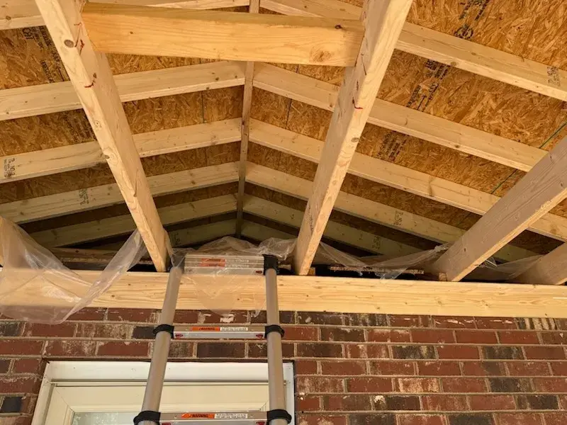 Rafters and decking over a new porch