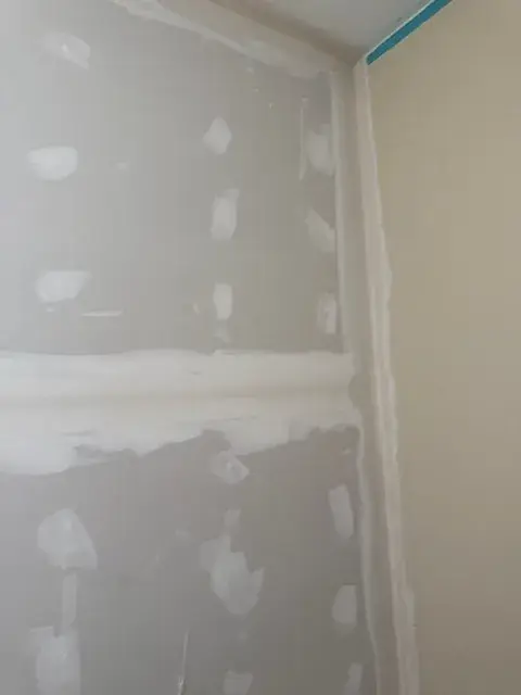Drywall seams finished in the corner of a room