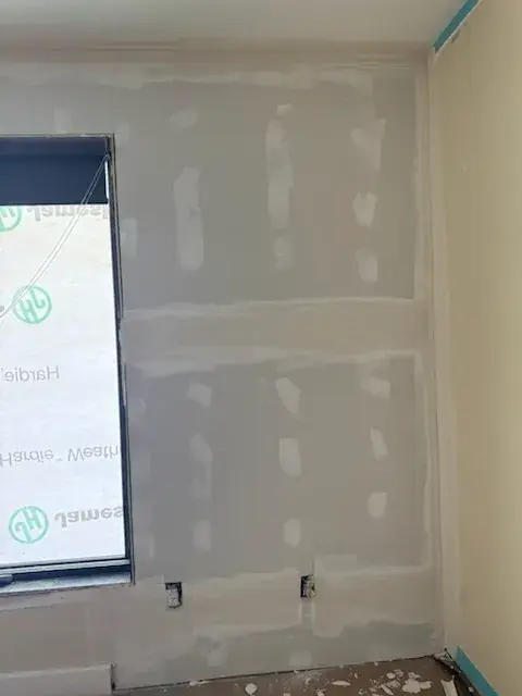 Finished drywall seams around a new window